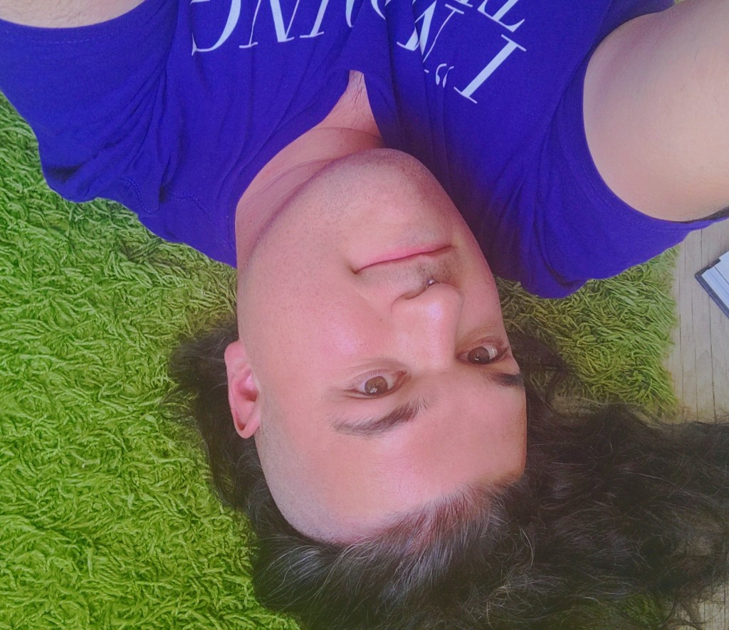 A photo of the author lying upside-down